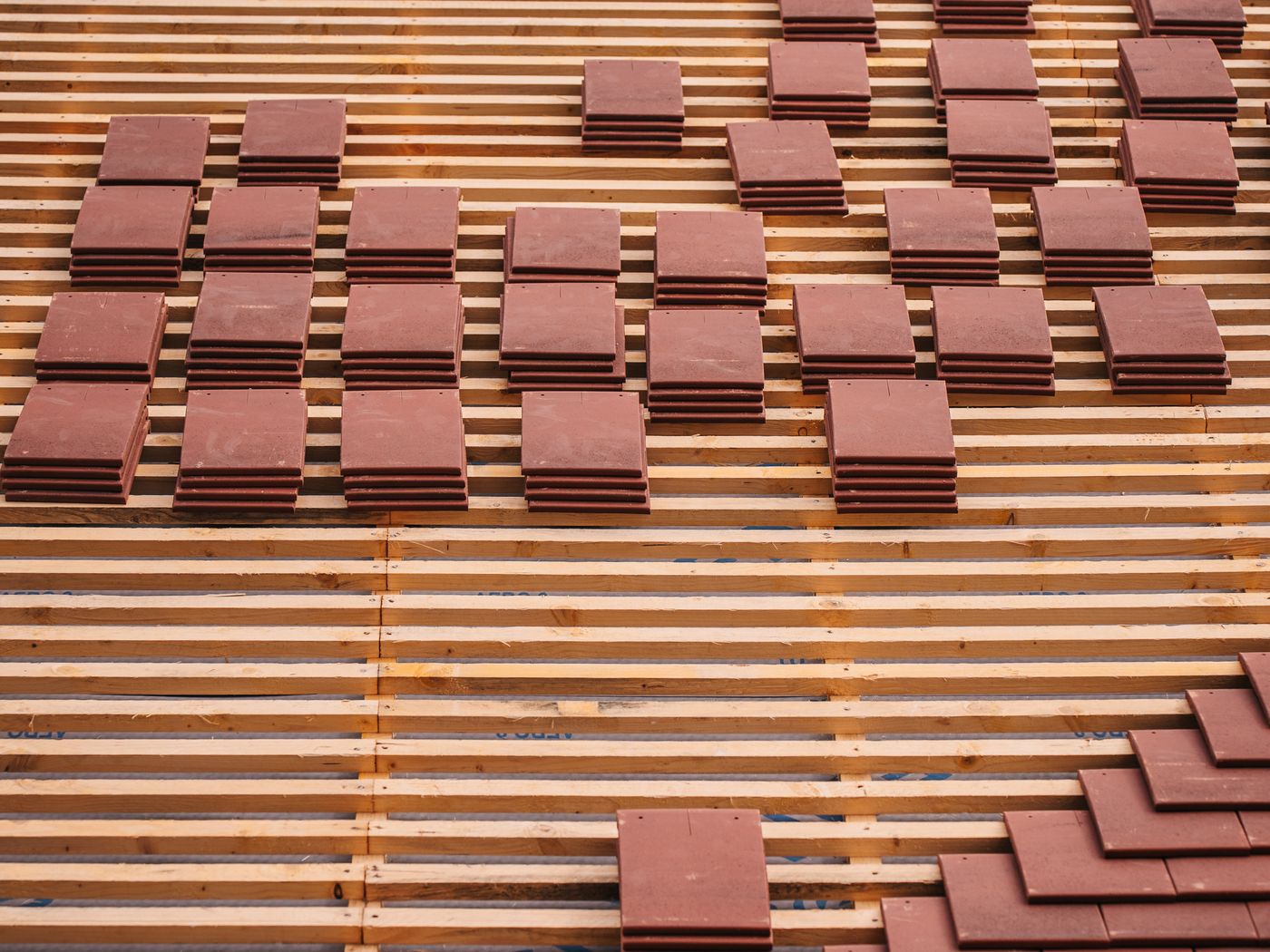 New clay tile roof being installed to current Building Regulations on a UK extension